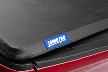 Load image into Gallery viewer, Tonno Pro 04-15 Nissan Titan 6.7ft (Incl 42-498 Utility Track Kit) Tonno Fold Tri-Fold Tonneau Cover